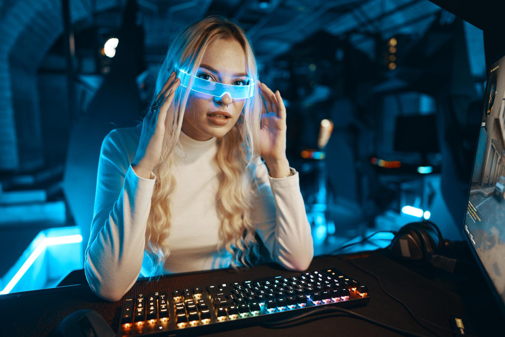 rubia gafas neon juega juegos computadora